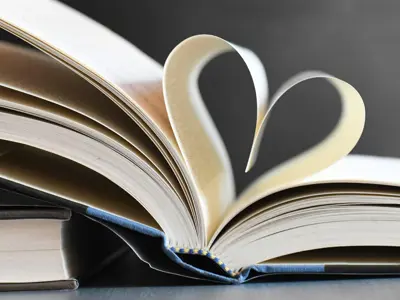 Pages of a book folded into a heart