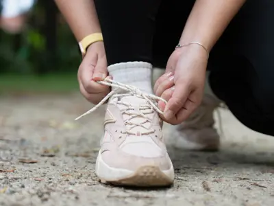 Lacing up a running shoe