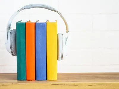 Headphones overtop of books